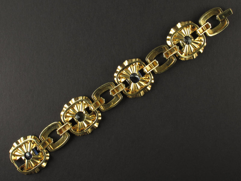 A yellow gold, diamond and yellow/blue sapphire bracelet. Period 1950 circa