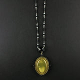 An Art Déco platinum, diamonds, natural pearls, onyx and jade pendant-watch