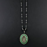An Art Déco platinum, diamonds, natural pearls, onyx and jade pendant-watch