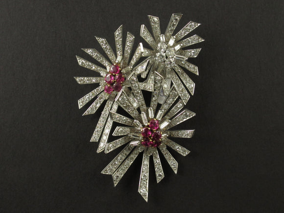 A platinum diamond and ruby brooch. 1940.
