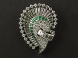 An Art Déco platinum, diamond and emerald brooch. 1925 circa
