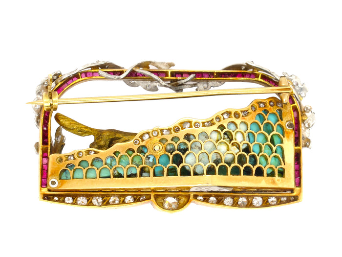 A very rare yellow gold and platinum brooch designed as a diamond and ruby frame. Italy 