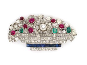 Art Déco platinum diamond, ruby emerald and sapphire basket brooch. France, 1925 c.a.