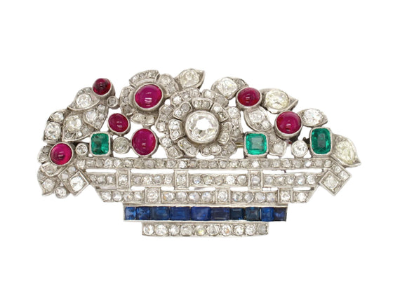 Art Déco platinum diamond, ruby emerald and sapphire basket brooch. France, 1925 c.a.