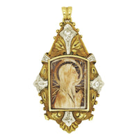 An Art Déco platinum, yellow gold, diamonds and bone Virgin Mary pendant.