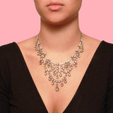 A XIX Century silver topped, Yellow gold and old-cut diamond necklace of draperie design.