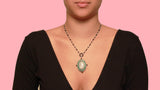 An Art Déco platinum, diamonds, natural pearls, onyx and jade pendant-watch