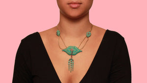 A Victorian XX Century yellow gold, silver, rubies turquoise and pearl necklace. 