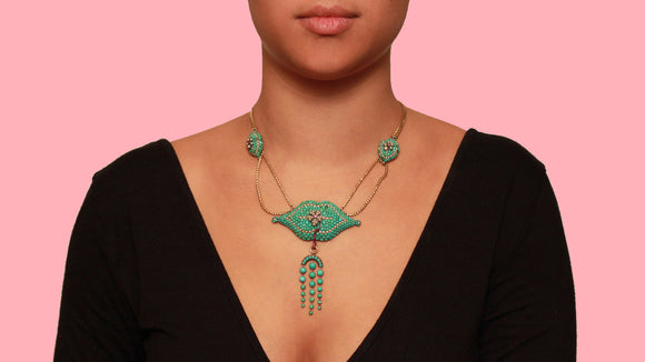 A Victorian XX Century yellow gold, silver, rubies turquoise and pearl necklace. 