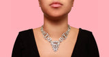 An Art Déco platinum and diamond necklace, transformable in two bracelets and one brooch. In original fitted box