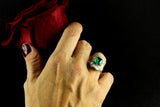 An Art Déco platinum diamond and emerald ring. 1930 c.a.