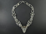An Art Déco platinum and diamond necklace, transformable in two bracelets and one brooch. In original fitted box
