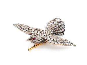 A XIX Century yellow gold, silver, rose cut diamond and rubies bird brooch