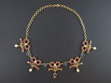 A festive yellow gold, ruby, diamond, pearls and sapphire vintage necklace, the ribbons are XIX century 