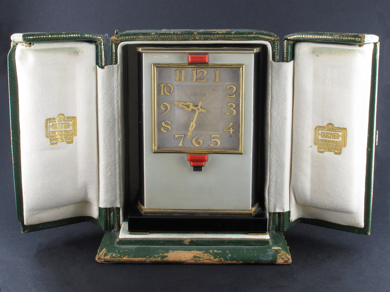 A rare yellow gold, black enamel, glass and coral electric Cartier desk timepiece 1931 In original Cartier fitted box 