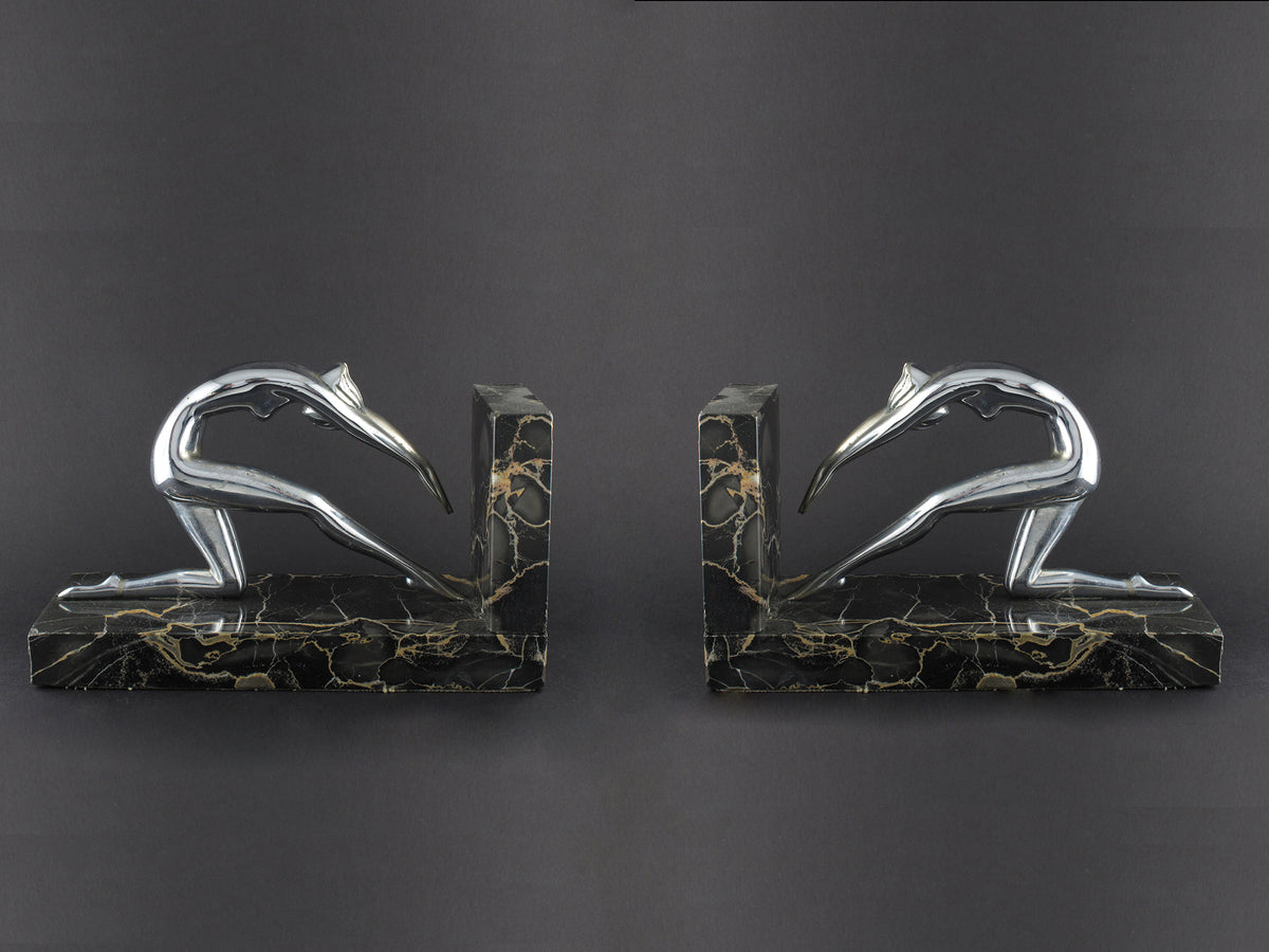 Art Déco silver and marble woman diving bookends.