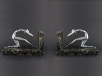 Art Déco silver and marble woman diving bookends.