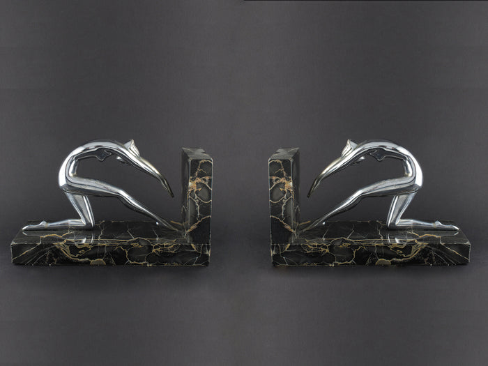 Art Déco silver and marble woman diving bookends.