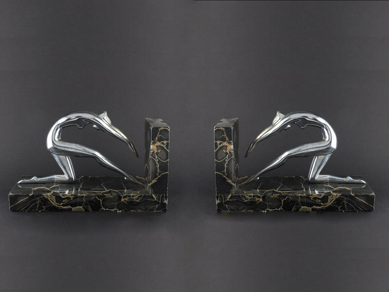 Art Déco silver and marble woman diving bookends.