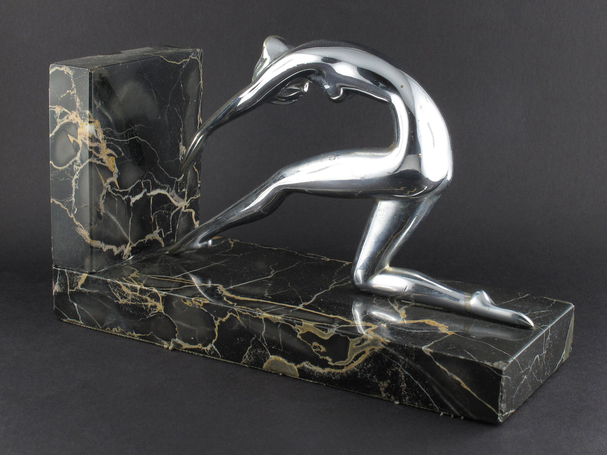 Art Déco silver and marble woman diving bookends.