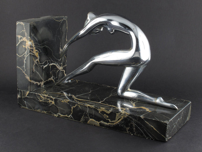 Art Déco silver and marble woman diving bookends.