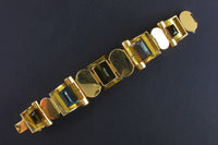 A very rare retro articulated bracelet with yellow and cognac citrine, aquamarine and a morganite. USA, 1940. 
