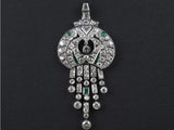 An Art Déco platinum diamond and emerald pendant. 1925 c.a.