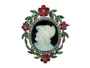 A museum quality silver topped yellow gold brooch with rose-cut diamonds, rubies, and emeralds. Centering a blacka nd white cameo depicting Menelao. Signed L.Rosi, piazza di Spagna, Roma. 1870 c.a. 