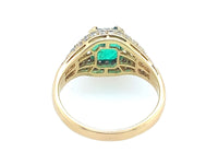 Anello Bulgari in oro giallo con diamanti e smeraldo colombiano trombino