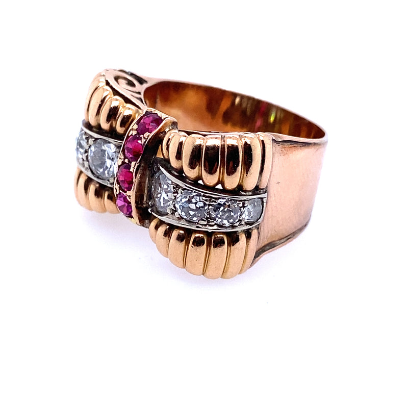 A yellow gold, diamond and ruby ring.