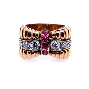 A yellow gold, diamond and ruby ring.