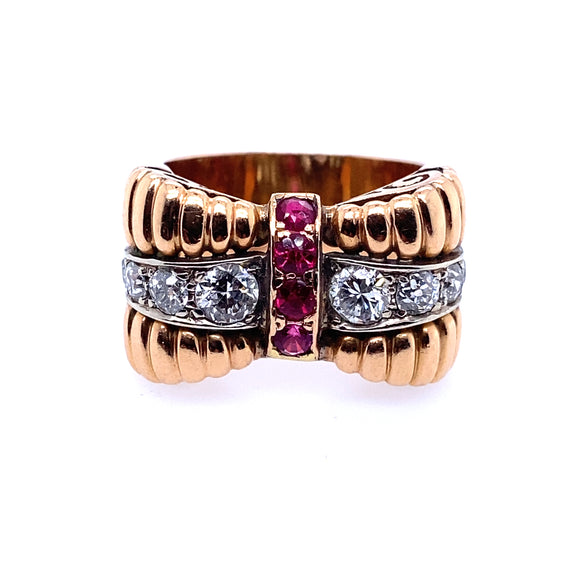 A yellow gold, diamond and ruby ring.