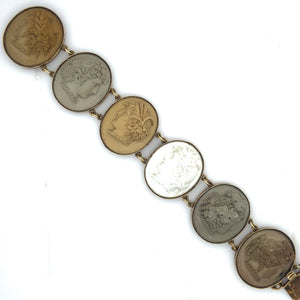 A 14 carats yellow gold bracelet with 6 lava cameos. Naples, XIX Century.
