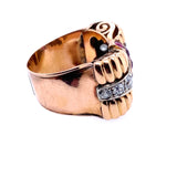 A yellow gold, diamond and ruby ring.