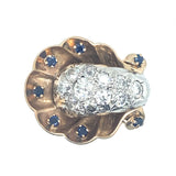 A yellow and white gold diamond and sapphire ring.