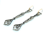 Long platinum and diamond pendant earrings between Edwardian and Art Deco