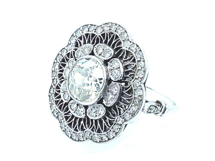 Anello edoardiano in platino e diamanti con margherita, 1910