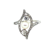 An Art Déco platinum, old cut diamond and natural perl ring