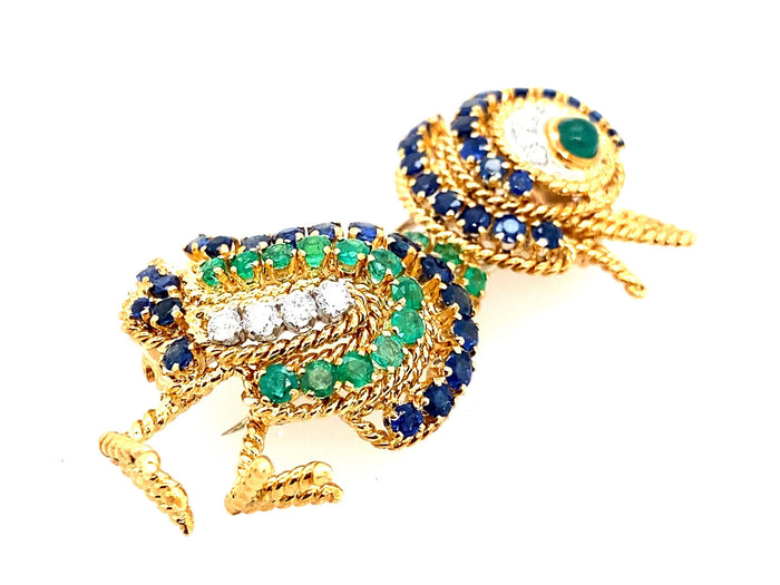 Van Cleef et Arpels gold diamond emerald and sapphire duck brooch.