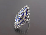A XIX Century silver topped, Yellow gold, rose-cut diamond marquise ring with blue enamel decors.