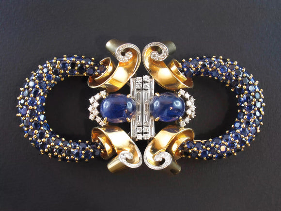 A very rare double clip brooch in Yellow gold and platinum with old-cut diamonds and sapphires. Marchak, 1940 c.a.