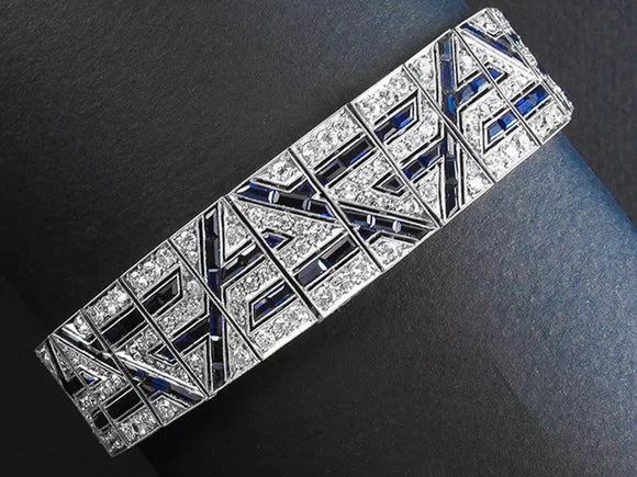 An Art Déco platinum diamond and sapphire bracelet. 1925